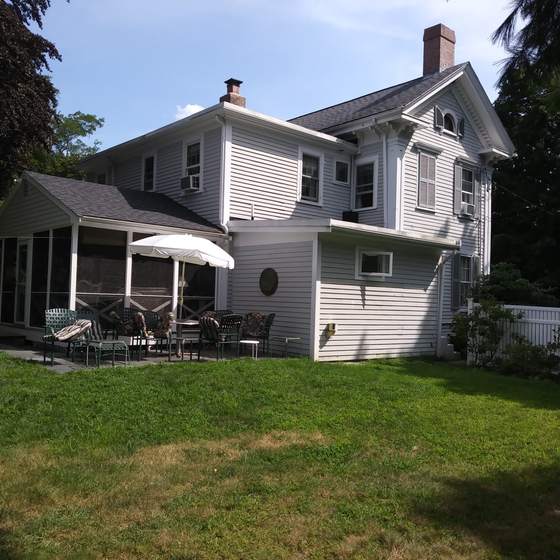 Colonial home with screened porch, freshly painted