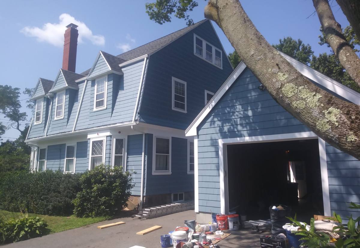 Gambrel home exterior repainted in harbor blue